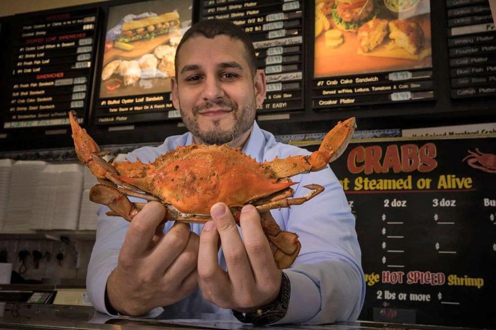 Cameron holding a Maryland crab